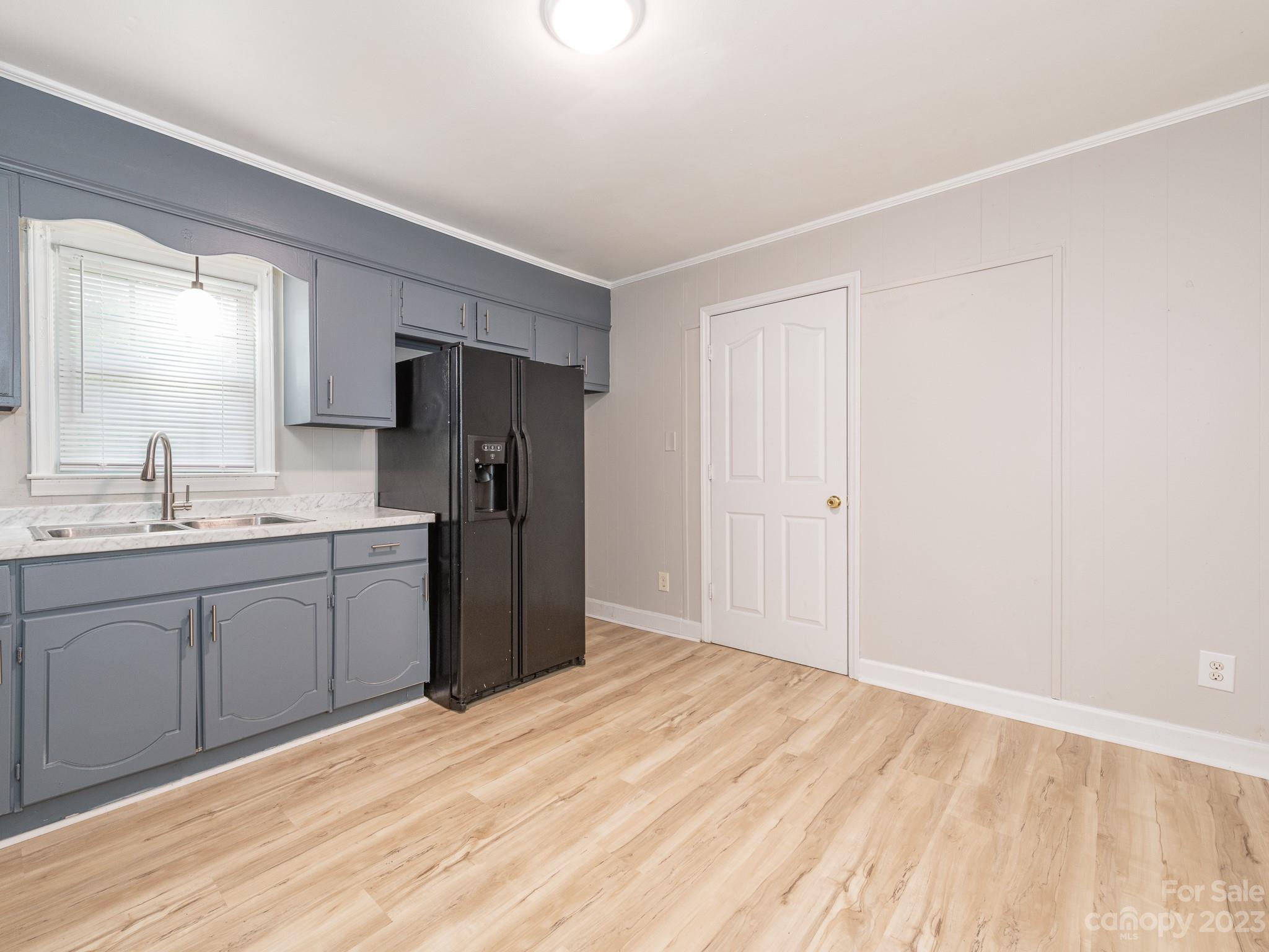 2824 Fordwood Drive Charlotte, NC 28208 - Photo 28 of 33 a kitchen with a refrigerator sink and cabinets