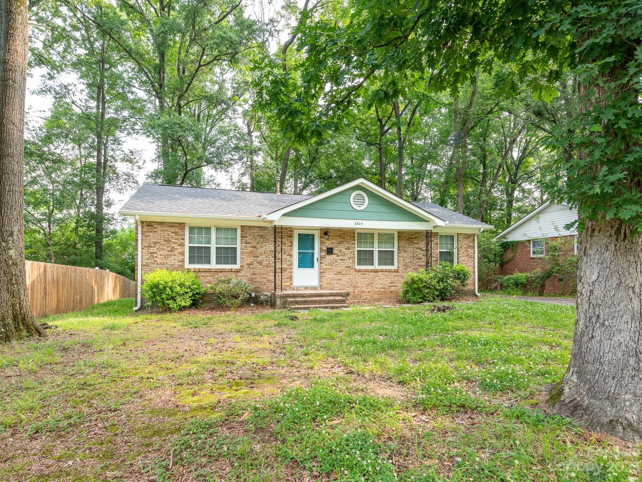 2824 Fordwood Drive Charlotte, NC 28208 - Photo 33 of 33 a front view of a house with a yard