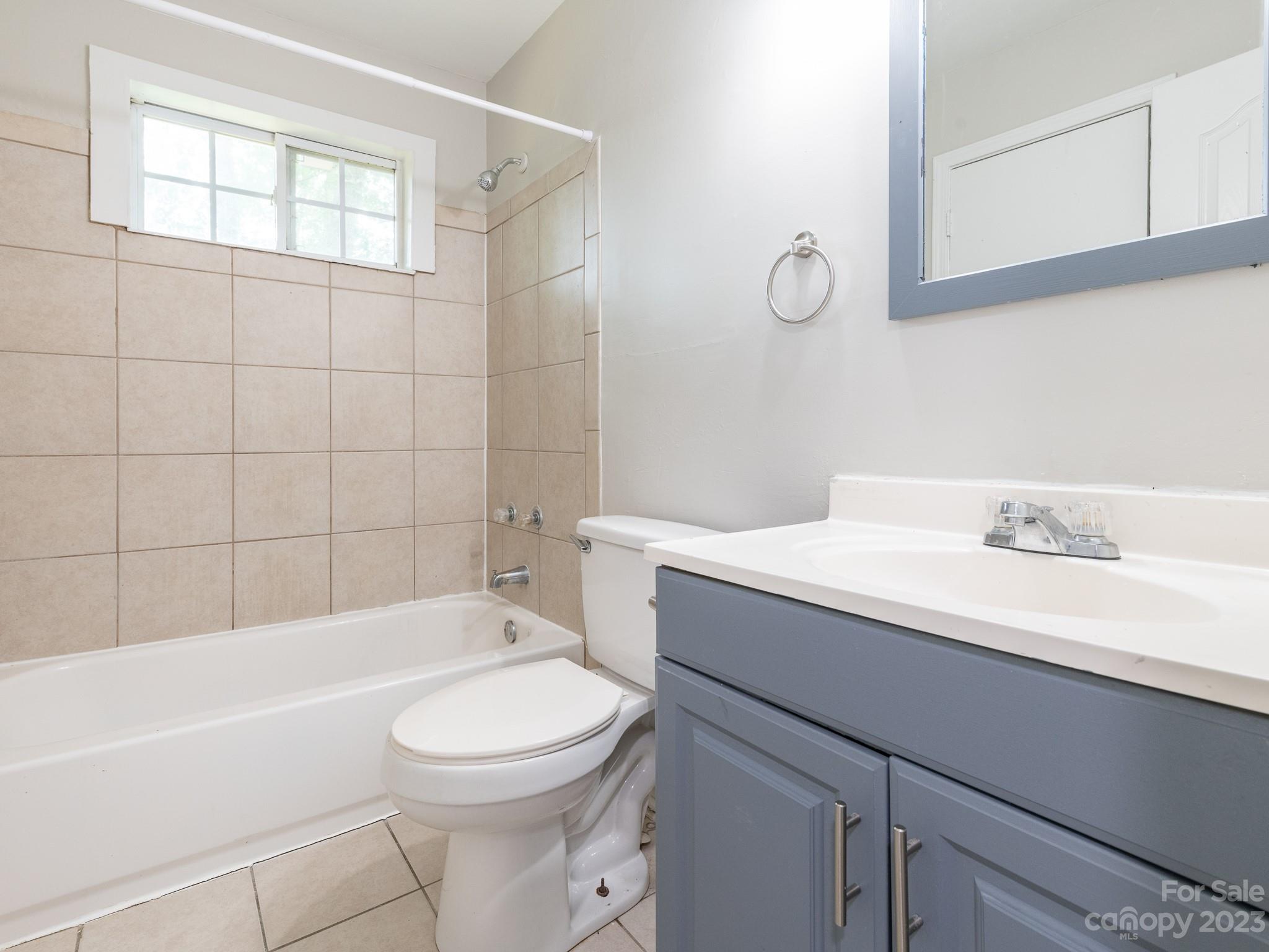 2824 Fordwood Drive Charlotte, NC 28208 - Photo 6 of 33 a bathroom with a sink a toilet and shower