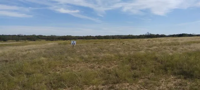 a view of lake with mountain in background
