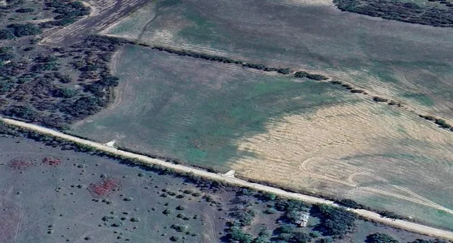 a view of a back yard of a house