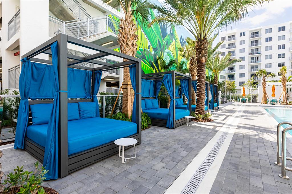 120 North Compass Way, Unit 230 Dania Beach, FL 33004 - Photo 24 of 42 a view of a chairs with a small park