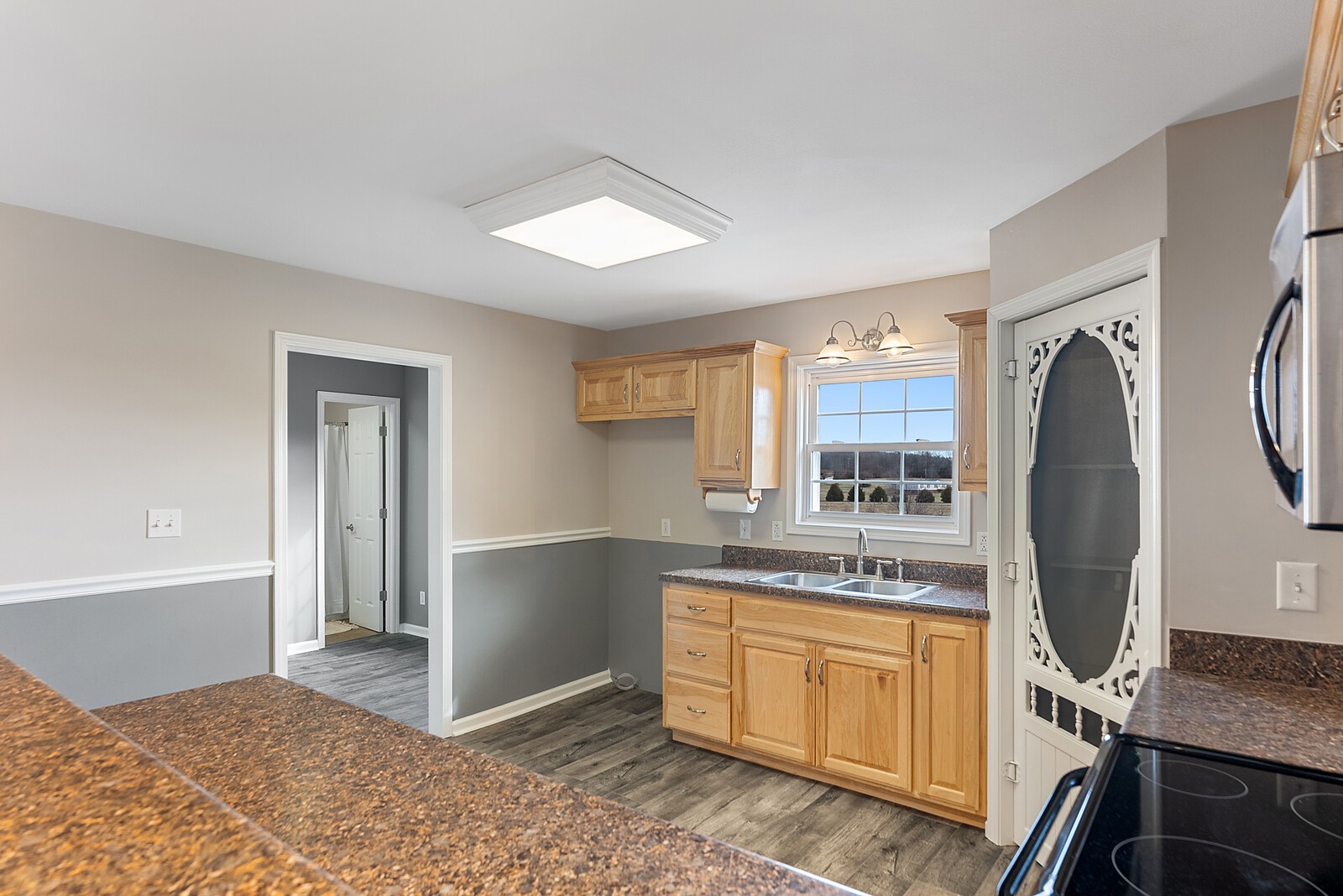 7064 South Lamont Road Springfield, TN 37172 - Photo 8 of 20 a kitchen with stainless steel appliances granite countertop a refrigerator and a stove top oven
