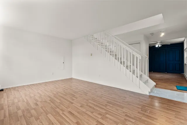 a view of an entryway with wooden floor