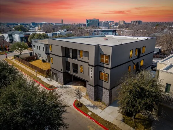 a view of city from balcony with furniture