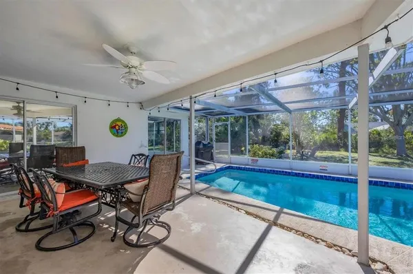 a view of a room with furniture and a table