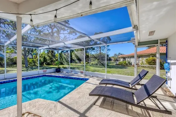 a view of a swimming pool with a patio