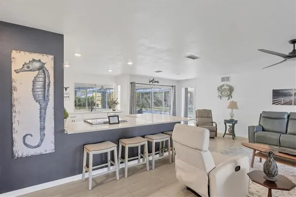 a dining room with furniture and window