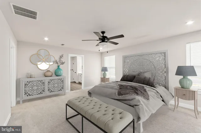 a bed room with a bed and a chandelier