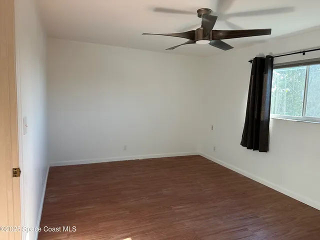 a view of an entryway with a hallway