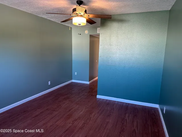 a bathroom with a granite countertop toilet sink and shower