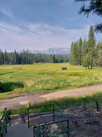 a view of a yard with an outdoor space and seating area