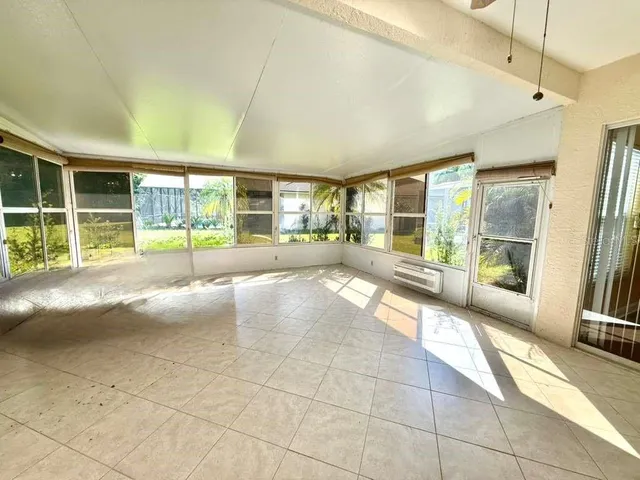 a view of an empty room with a fireplace