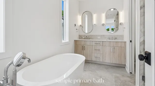 a bathroom with a granite countertop sink a mirror and vanity