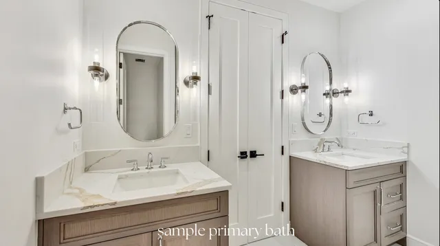 a bathroom with a sink vanity granite and a mirror
