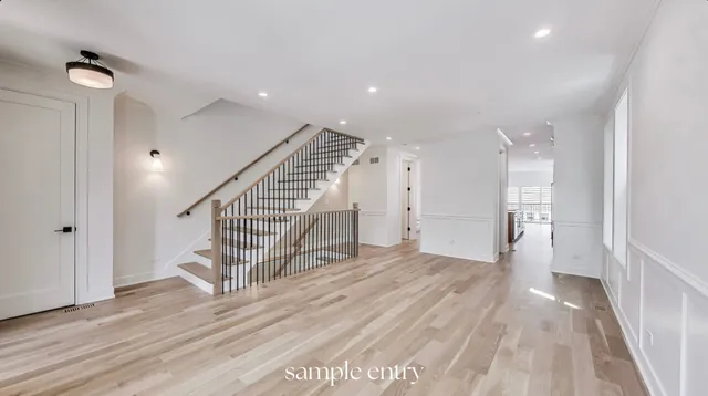 a view of entryway with wooden floor