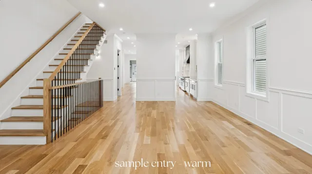 a view of an entryway with wooden floor