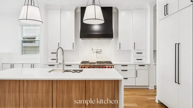 a kitchen with a sink a stove and a wooden floor