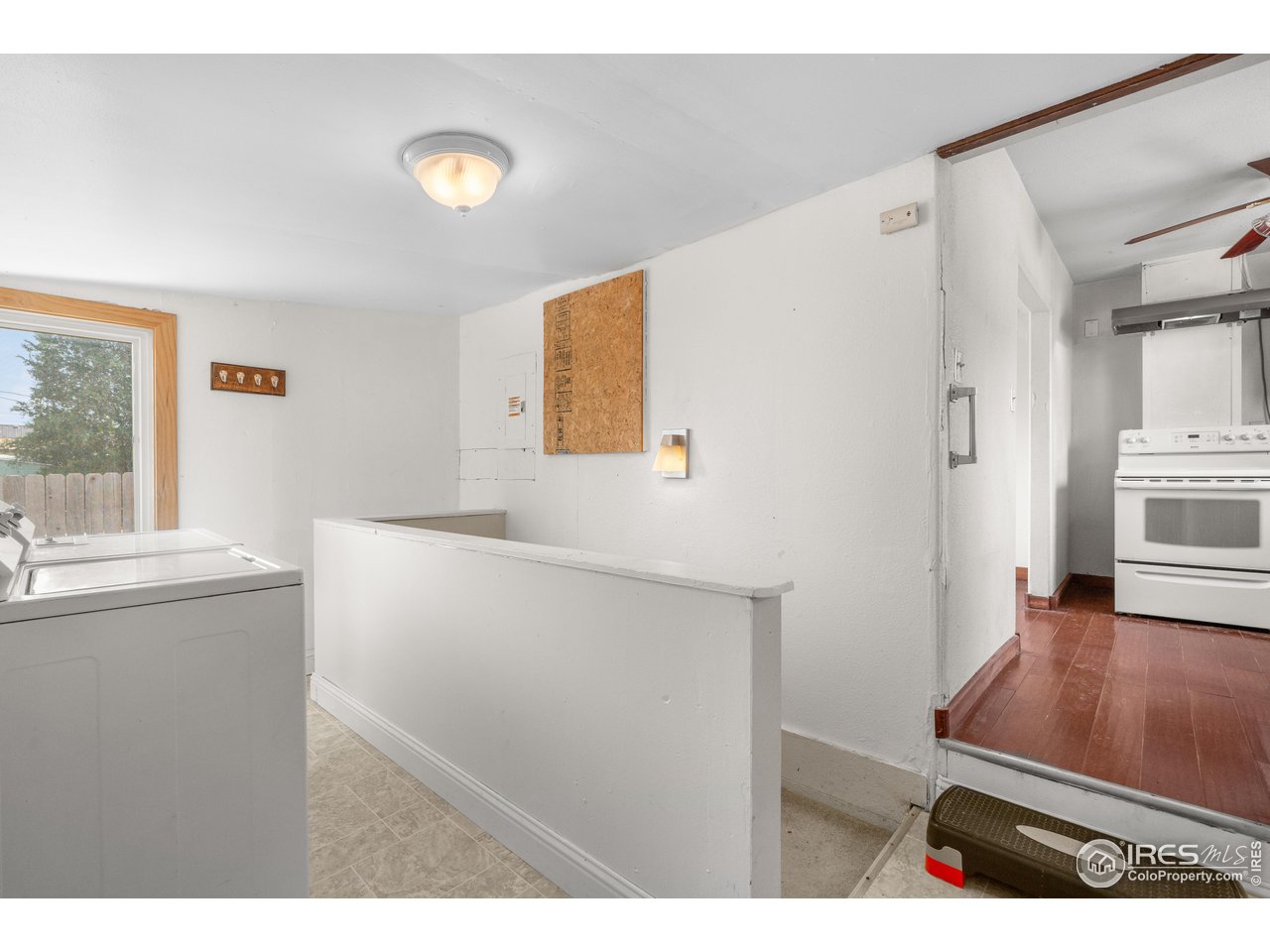 2706 7th Avenue Garden City, CO 80631 - Photo 17 of 47 a view of kitchen with furniture and wooden floor