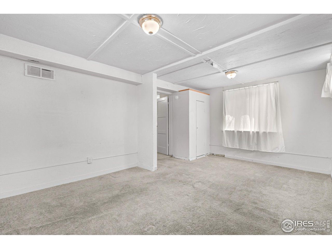 2706 7th Avenue Garden City, CO 80631 - Photo 26 of 47 a view of an empty room with a window