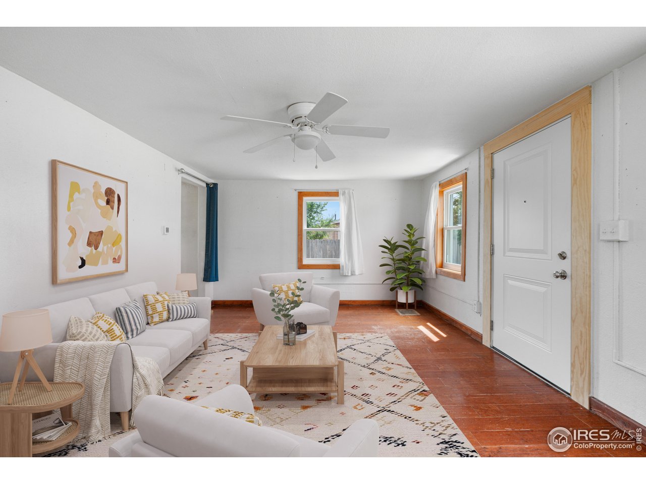 2706 7th Avenue Garden City, CO 80631 - Photo 6 of 47 a living room with furniture and wooden floor