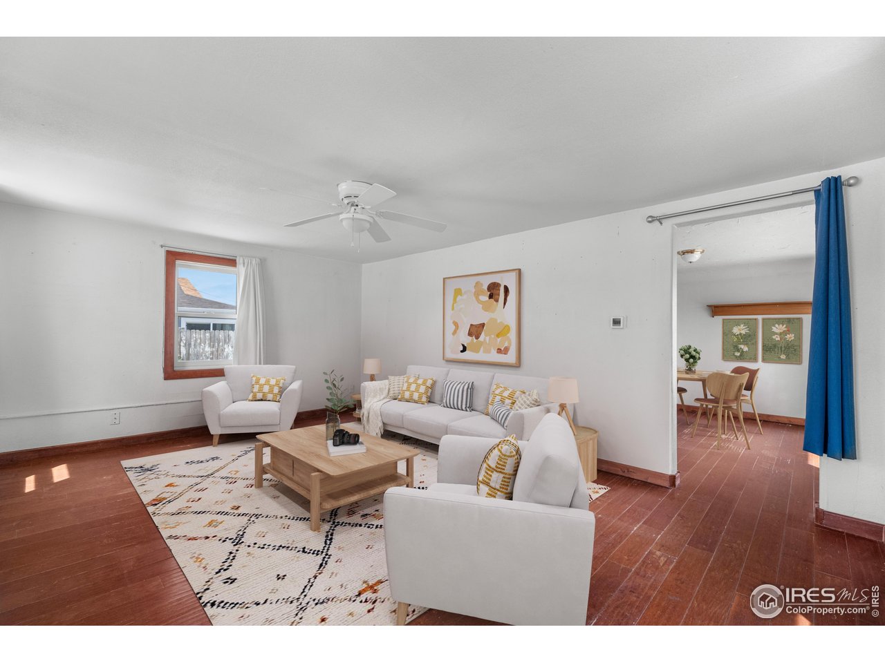 2706 7th Avenue Garden City, CO 80631 - Photo 8 of 47 a living room with furniture and wooden floor