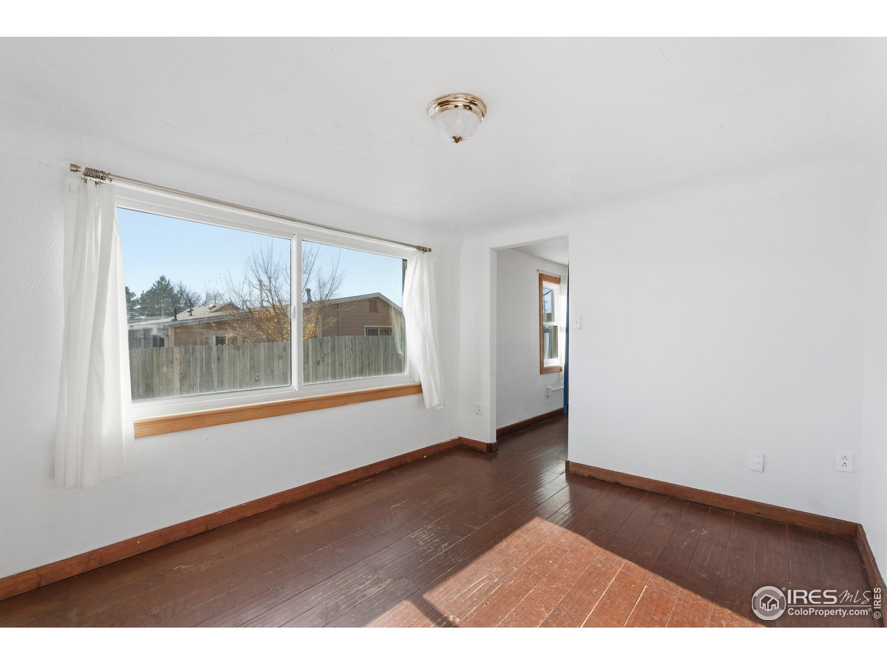 2706 7th Avenue Garden City, CO 80631 - Photo 9 of 47 a view of an empty room with a window