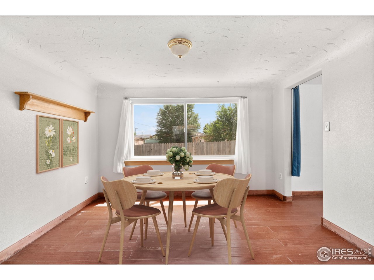 2706 7th Avenue Garden City, CO 80631 - Photo 10 of 47 a view of a dining room with furniture and wooden floor