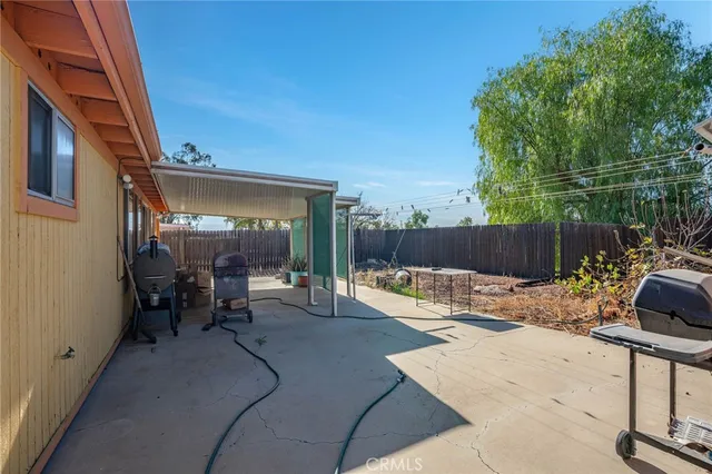 a view of a backyard with a patio