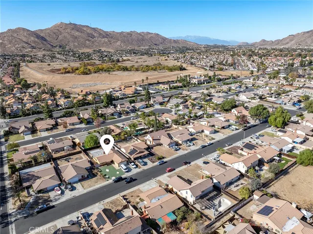 an aerial view of residential houses with outdoor space