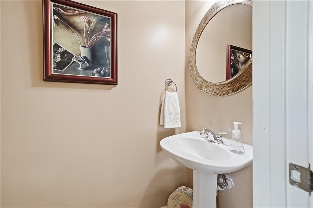 608 Myers Gate Road Ball Ground, GA 30107 - Photo 14 of 31 a bathroom with a sink and a mirror