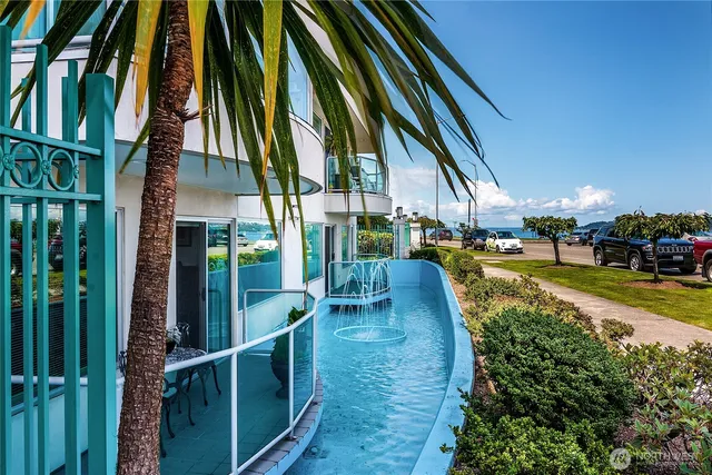 a view of outdoor space with swimming pool and sitting space