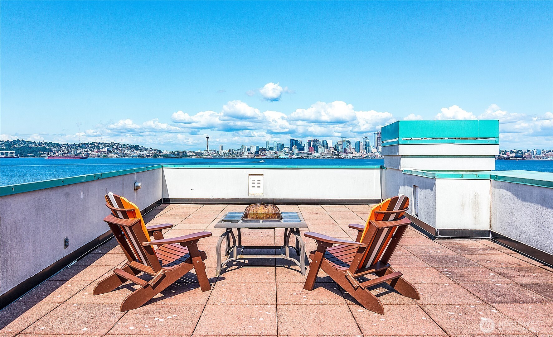 1027 Harbor Avenue Southwest, Unit 303 Seattle, WA 98116 - Photo 5 of 20 a view of a terrace with furniture and stove