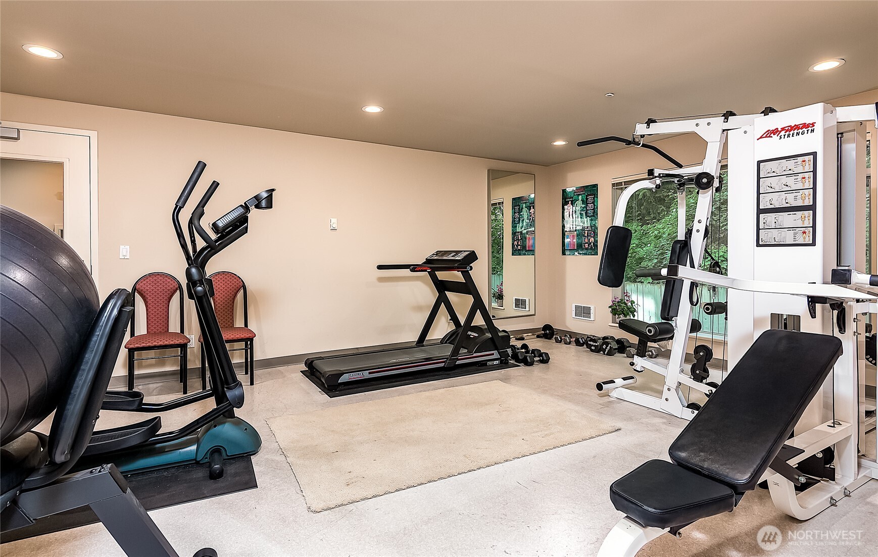 1027 Harbor Avenue Southwest, Unit 303 Seattle, WA 98116 - Photo 7 of 20 a view of a room with gym equipment