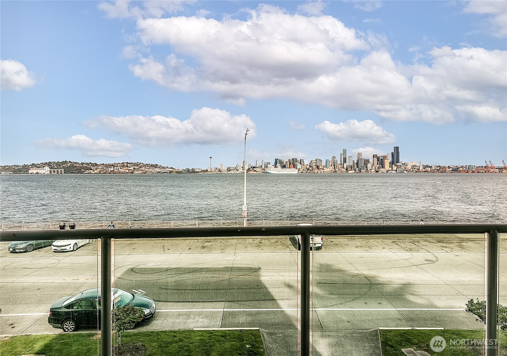 1027 Harbor Avenue Southwest, Unit 303 Seattle, WA 98116 - Photo 8 of 20 a view of a lake with a big yard