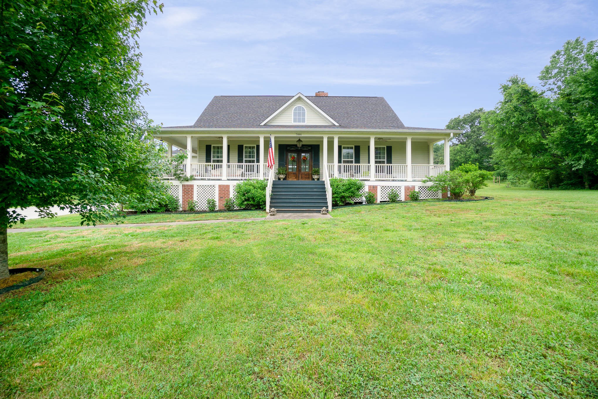 7881 Pinewood Road Fairview, TN 37062 - Photo 1 of 40 a front view of a house with a yard