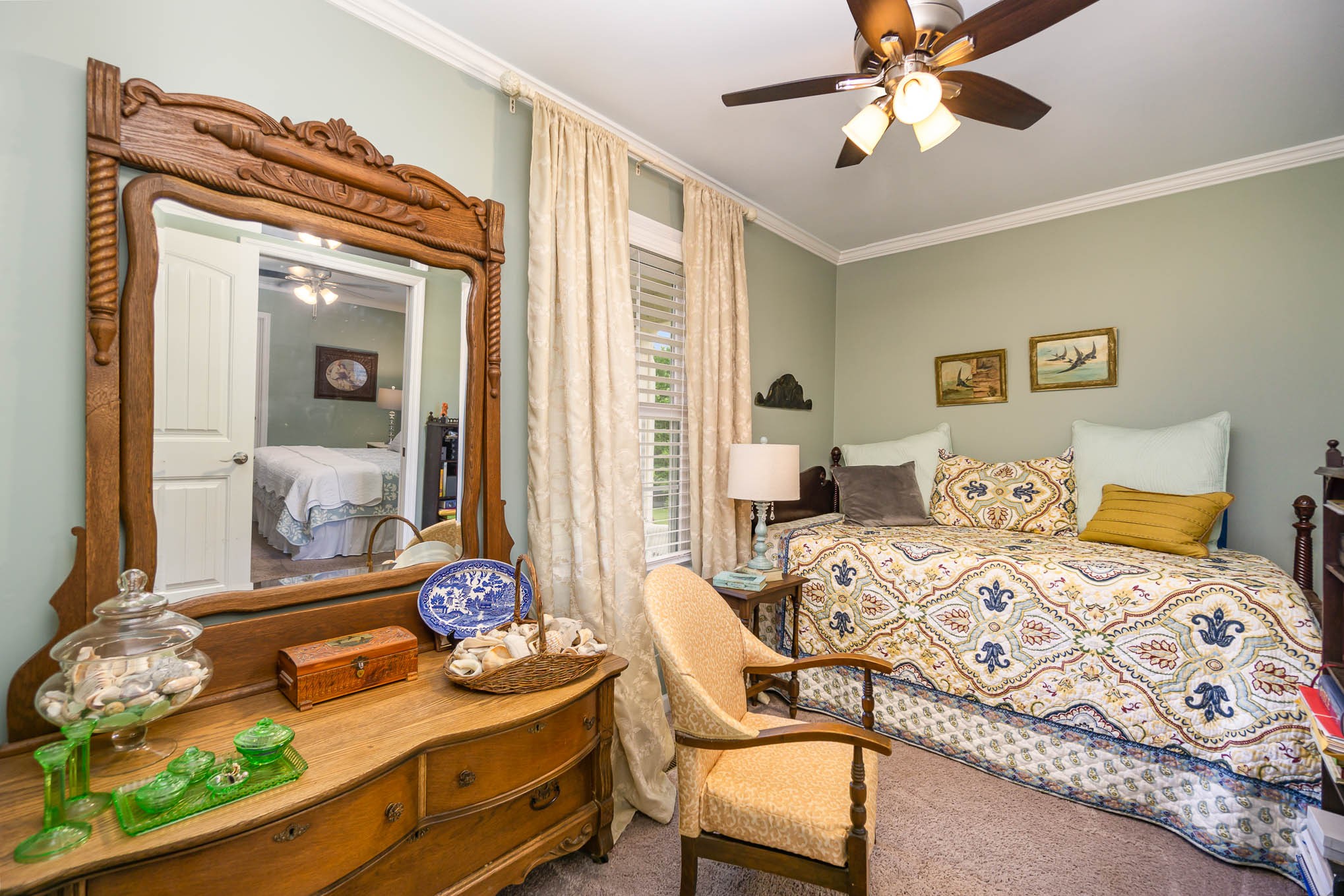 7881 Pinewood Road Fairview, TN 37062 - Photo 14 of 40 a bedroom with a bed and a chandelier