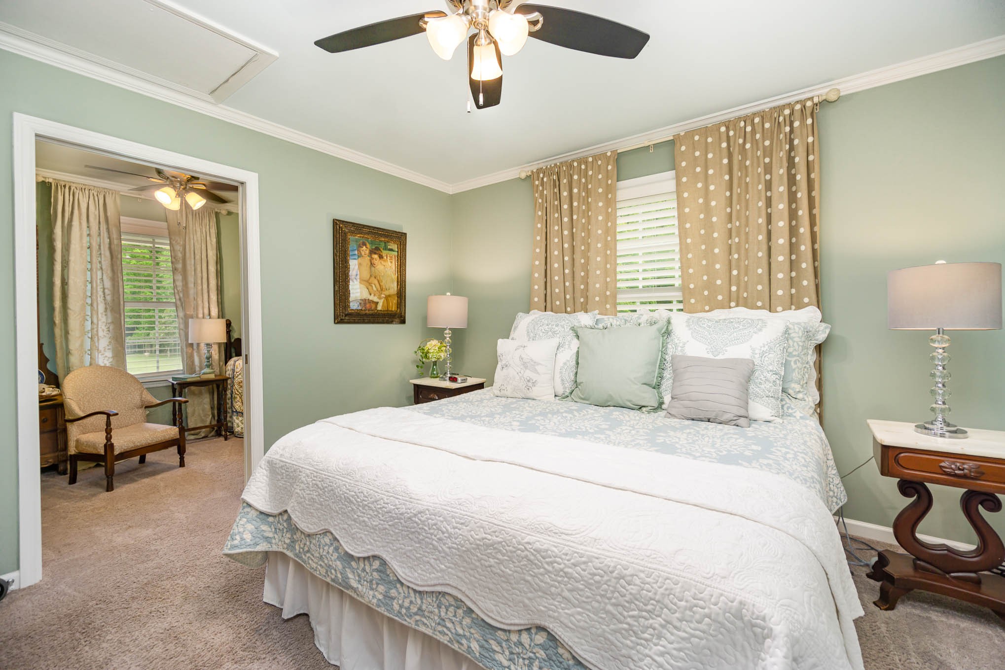 7881 Pinewood Road Fairview, TN 37062 - Photo 15 of 40 a bedroom with a bed and a chandelier
