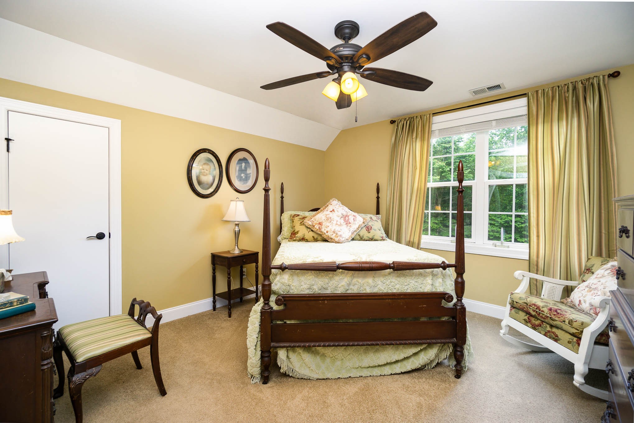 7881 Pinewood Road Fairview, TN 37062 - Photo 26 of 40 a bedroom with a bed and a chandelier