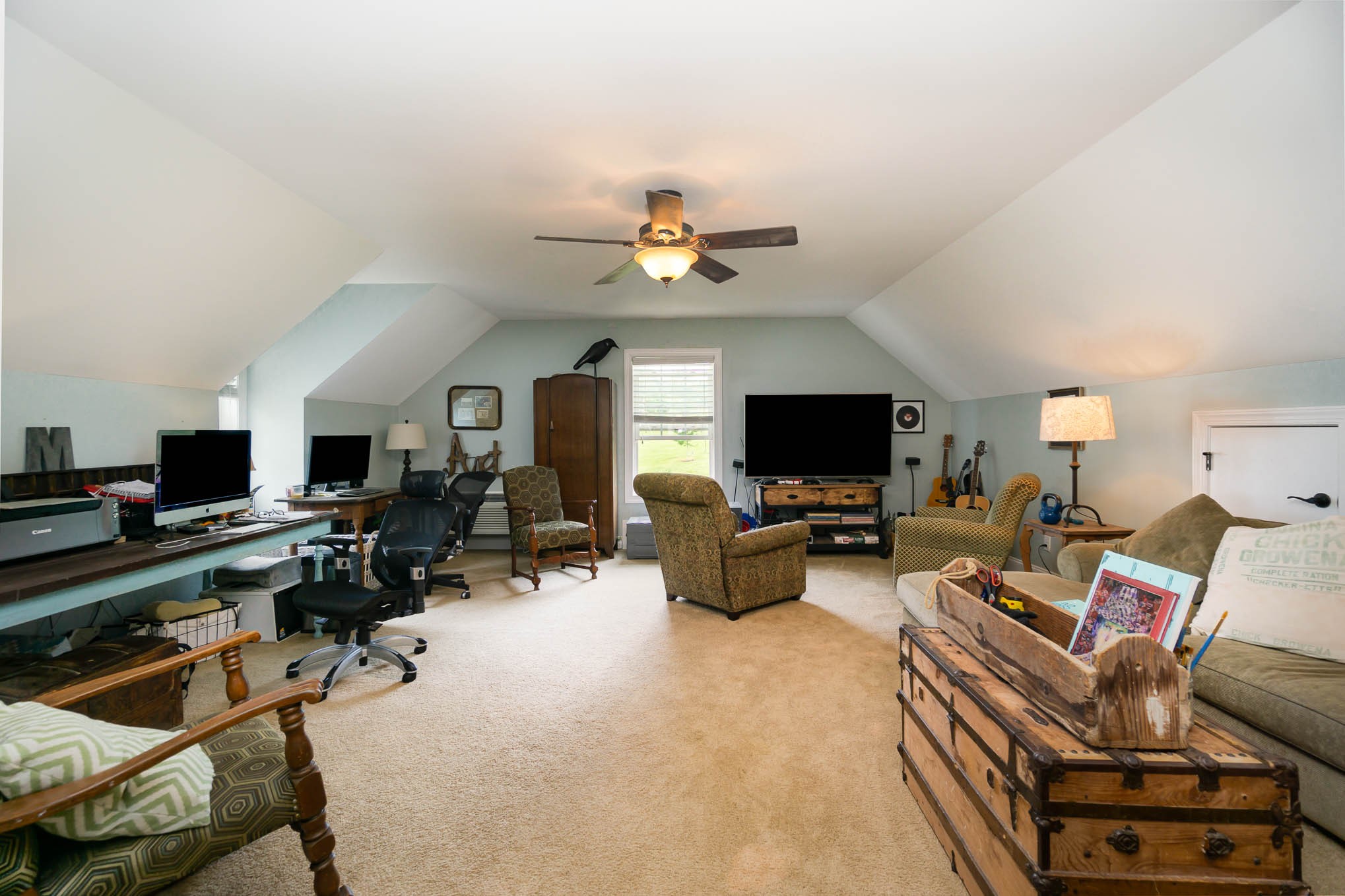 7881 Pinewood Road Fairview, TN 37062 - Photo 28 of 40 a living room with furniture a flat screen tv and kitchen view