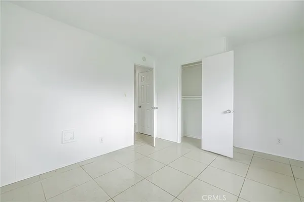 a bathroom with a toilet a sink and a window