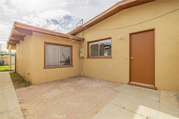 a view of a backyard of the house