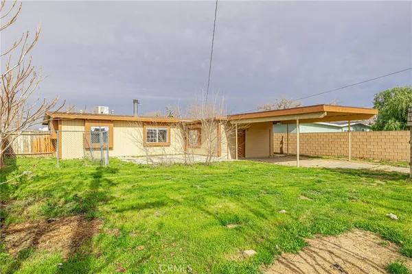 a house view with a backyard space