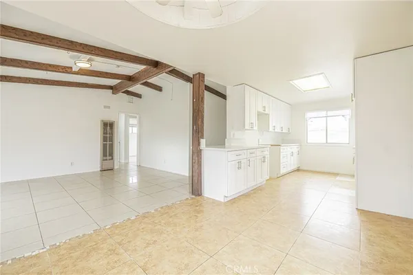 a view of a kitchen with a sink and cabinets