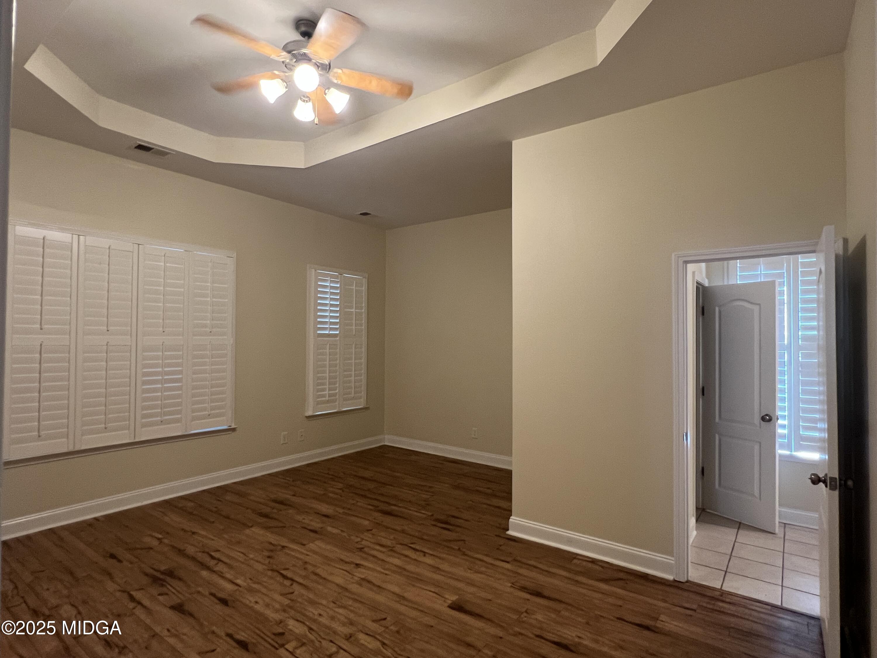 644 Ivy Brook Way Macon, GA 31210 - Photo 12 of 29 wooden floor in an empty room with a window