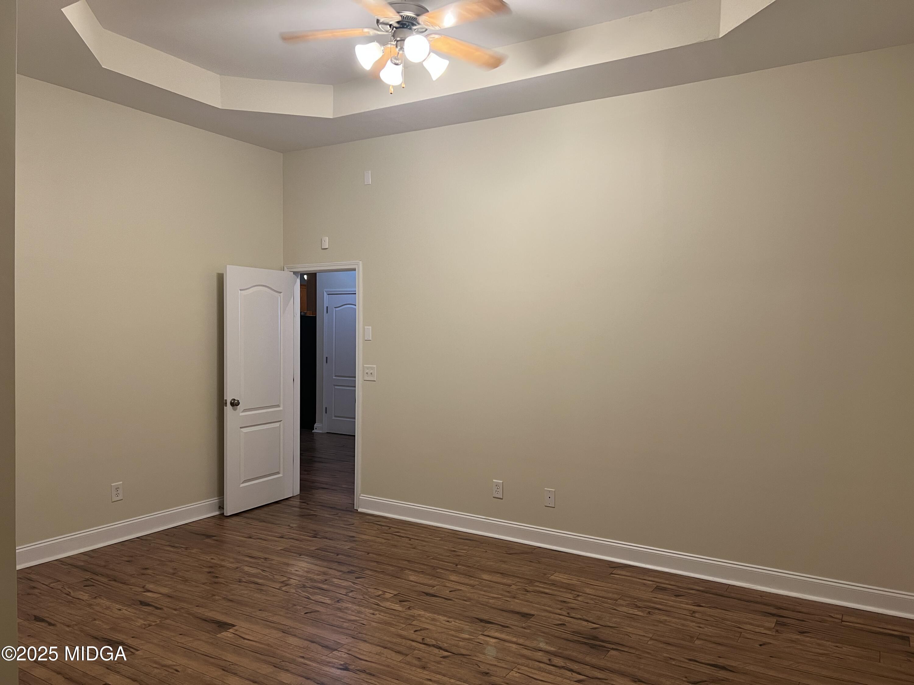 644 Ivy Brook Way Macon, GA 31210 - Photo 14 of 29 a view of an empty room with wooden floor
