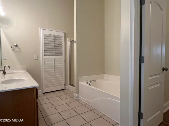 a bathroom with a bathtub sink and toilet