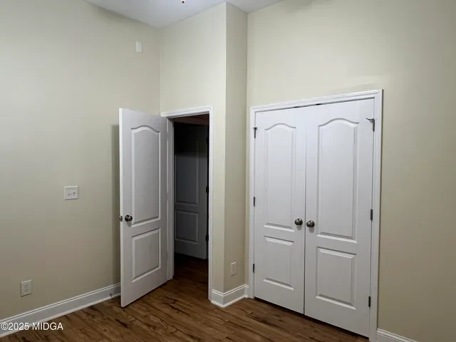 a view of a bathroom with wooden floor