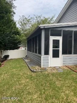 a house with trees in the background