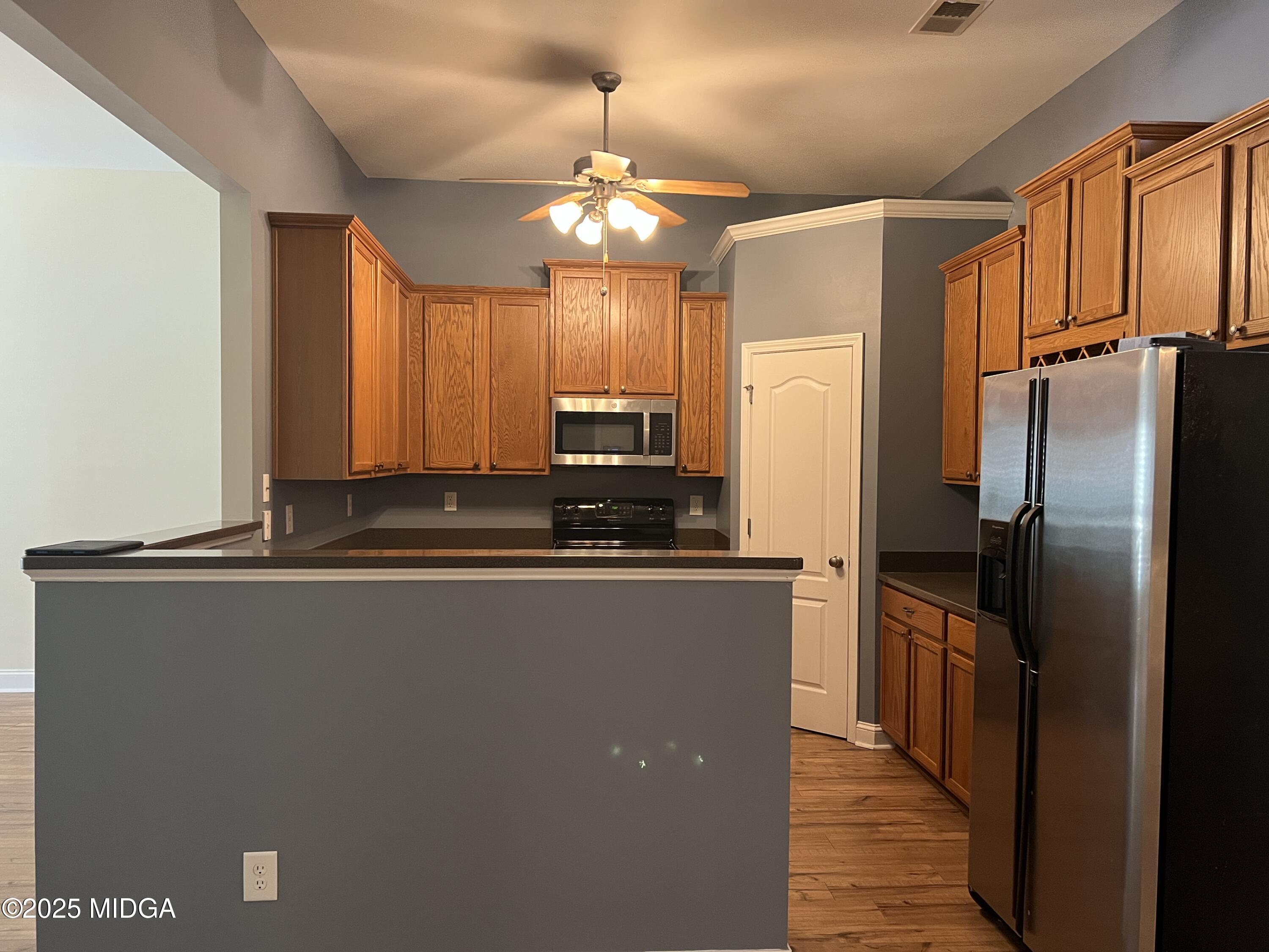 644 Ivy Brook Way Macon, GA 31210 - Photo 5 of 29 a kitchen with stainless steel appliances granite countertop a refrigerator a sink and a stove